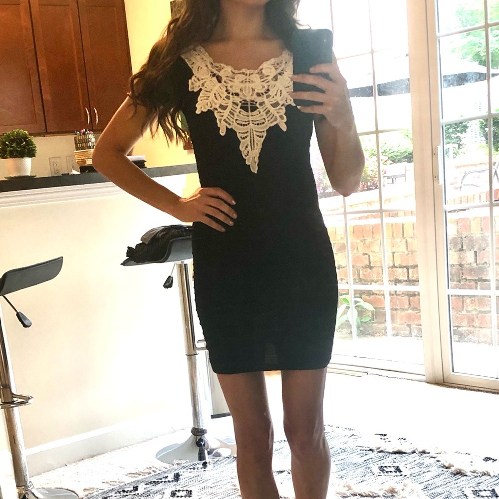 Holiday dress size small little black dress with white lace. Stretchy material